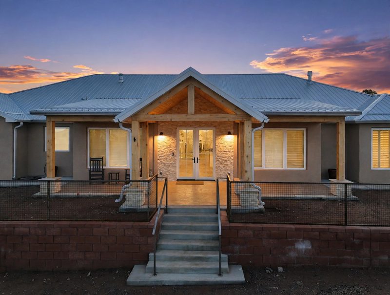Twilight at the entry of a custom home in Tijeras